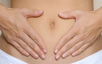 woman with hands on her stomach